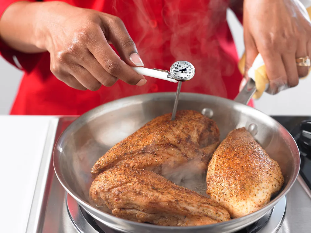 food thermometer checking chicken temperature
